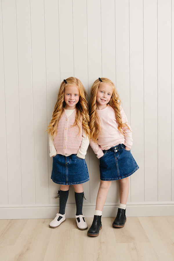 Dark wash denim skirt for babies, stylish and comfortable, perfect for everyday wear. Angle 4 view.