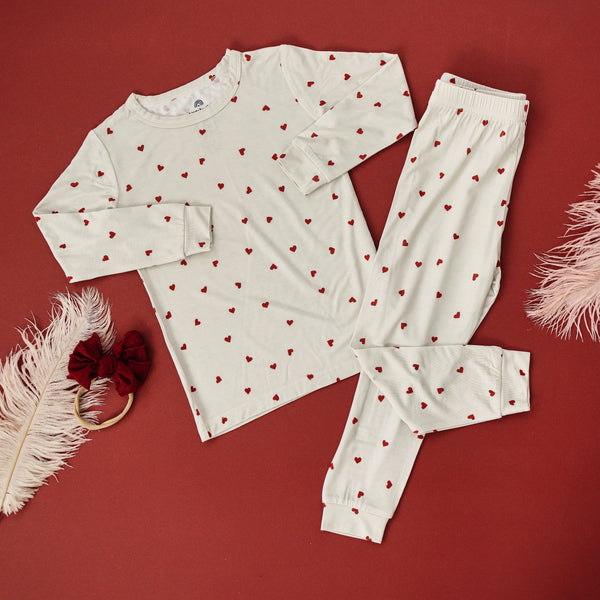 Tiny Hearts 2pc Bamboo Pajamas for babies, soft and breathable sleepwear in a cozy angle view.