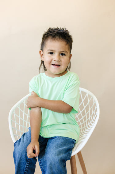 Lime green bamboo tee for babies, stylish and eco-friendly furniture piece for nurseries.