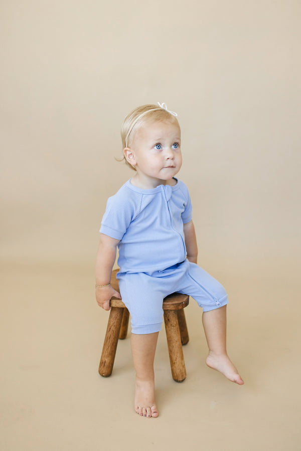 Solid ribbed bamboo shorty romper in various colors, angle view 7, perfect for stylish baby outfits.