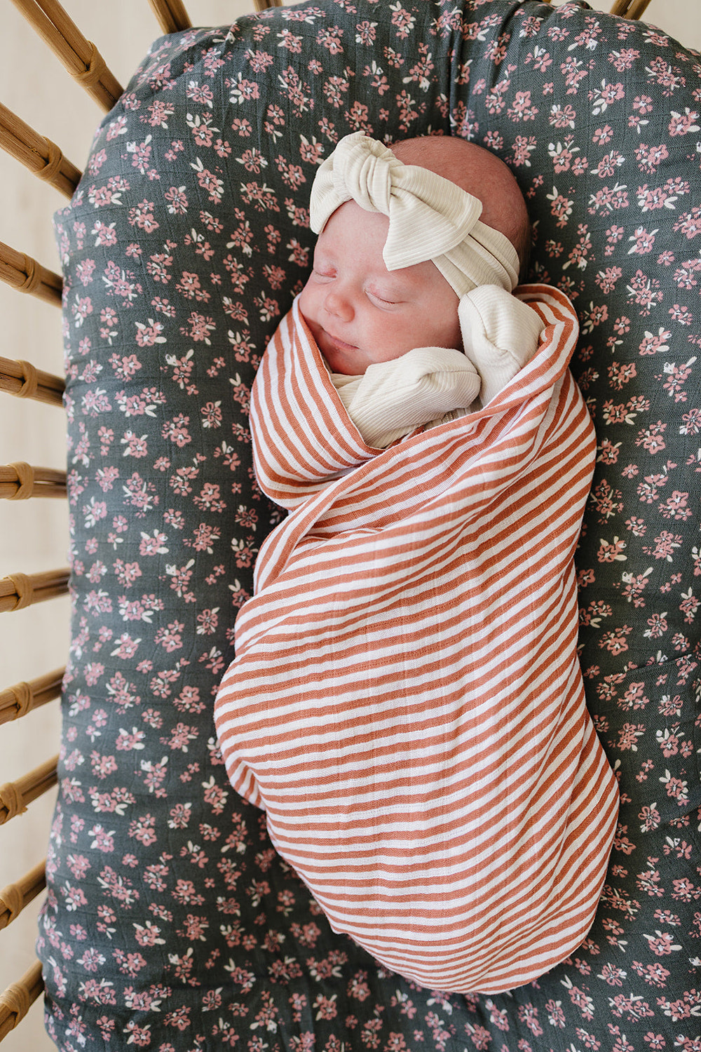 Pink stripes muslin swaddle blanket for babies, soft and breathable, perfect for swaddling and comfort.
