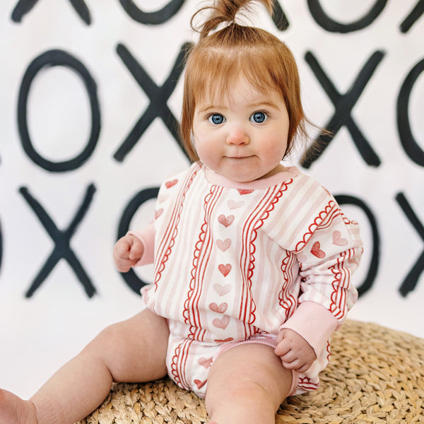 Laced with Love Sweatshirt Romper for babies, cozy and stylish, shown from angle 9. Perfect for playful outings!
