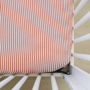 Pink stripes muslin crib sheet for cozy and stylish baby bedding and sleep.
