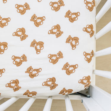 Teddy bear muslin crib sheet for cozy and stylish baby bedding and sleep.