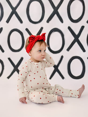 Tiny Hearts Bamboo Zippy Pajamas for babies in soft, breathable fabric, perfect for comfortable sleep and play.