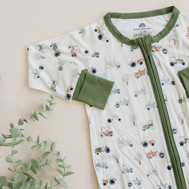 Tiny Tractors Bamboo Zippy Pajamas for babies in a cozy, stylish design. Perfect for comfort and playtime.