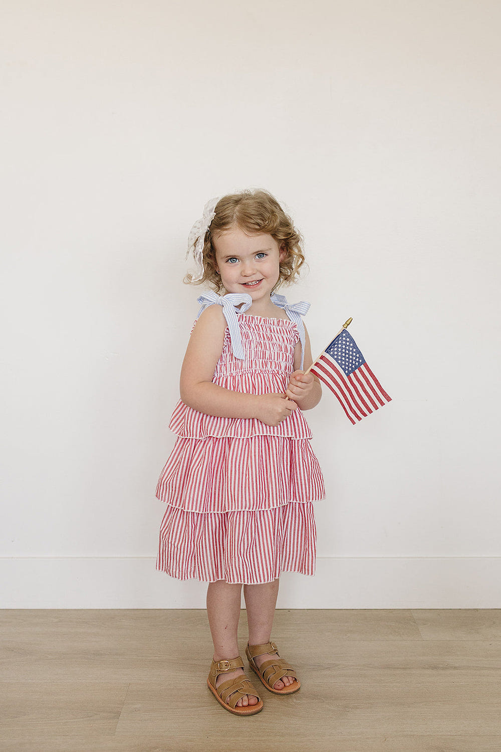"Stripe ruffle dress for babies, featuring playful stripes and stylish ruffles, perfect for any occasion."