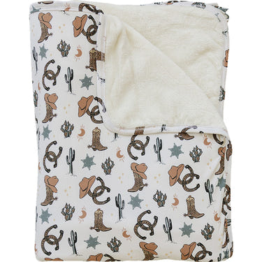 Outlaw Cowboy Bamboo Fleece Quilt - Cozy wall art for nursery decor, featuring a charming cowboy design.