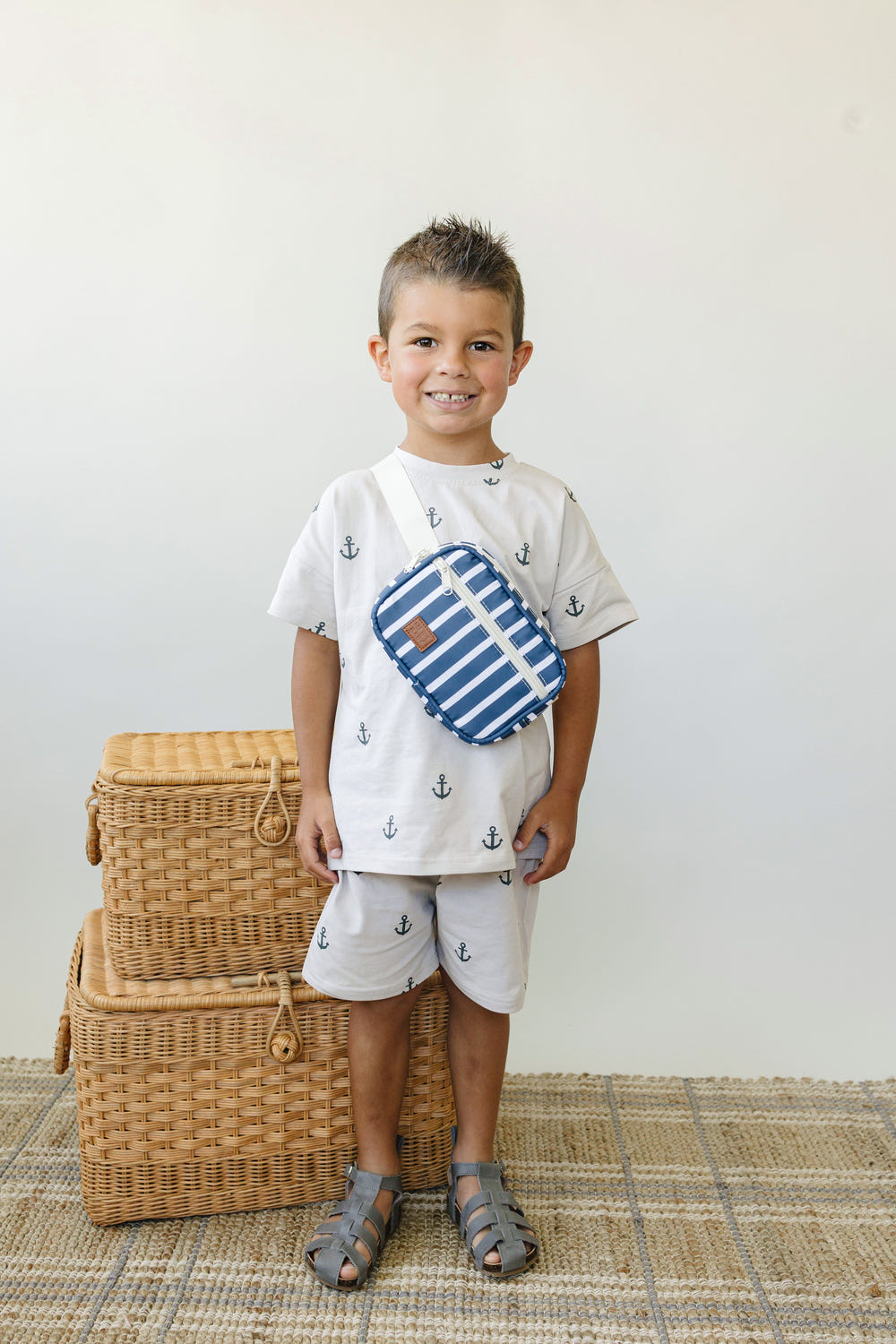 Navy stripe mini fanny pack for babies, perfect for toys and entertainment on-the-go.