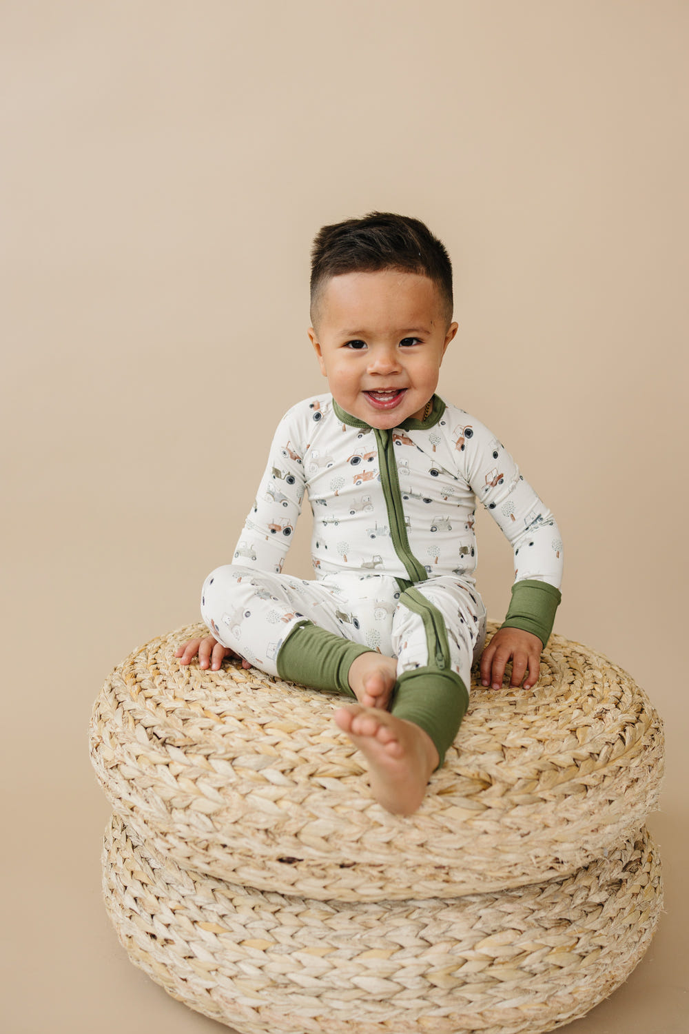 Tiny Tractors Bamboo Zippy Pajamas for babies in a cozy, stylish design. Perfect for comfort and playtime.