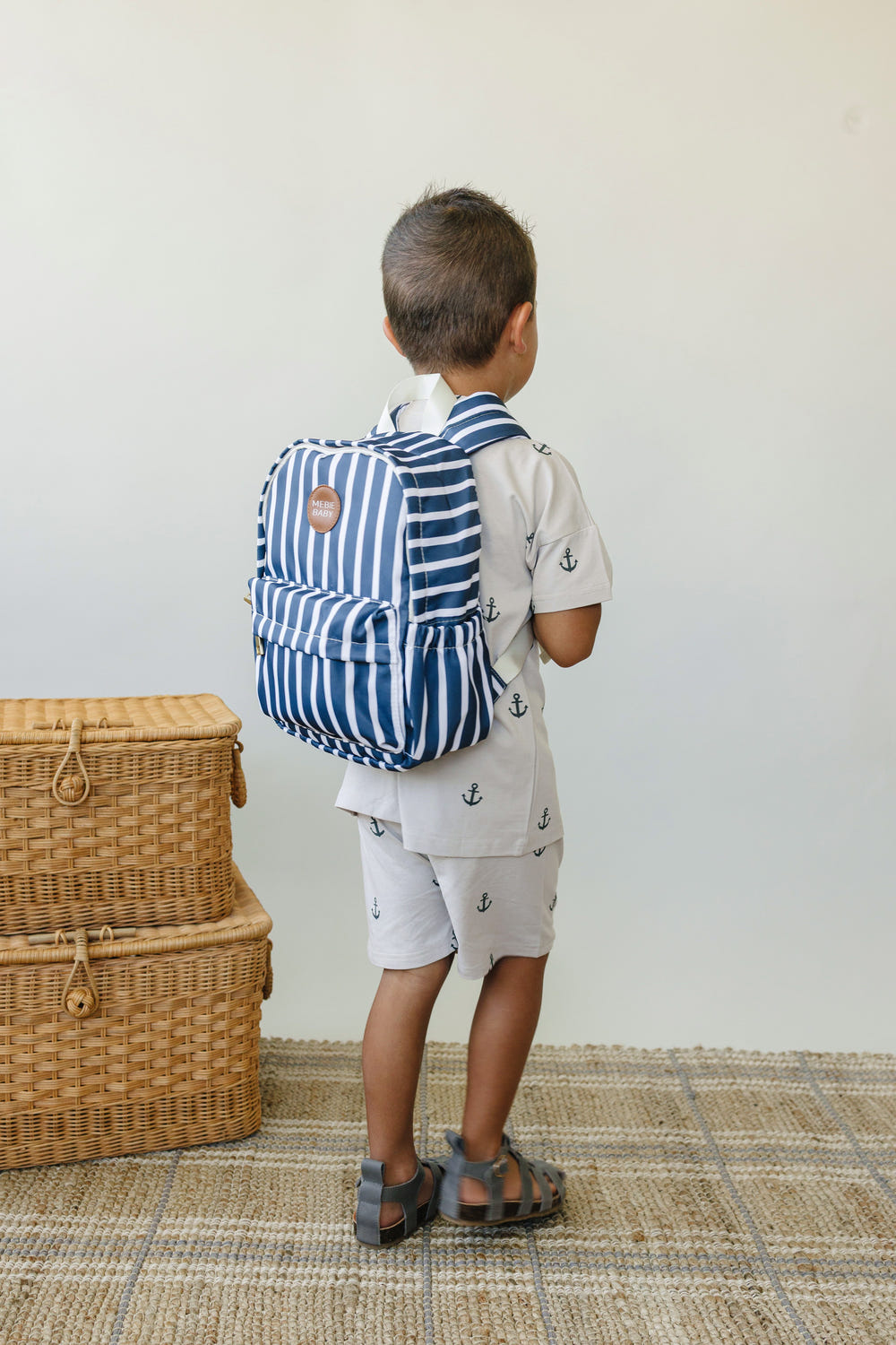 Navy stripe mini backpack for babies, perfect for gear and equipment on-the-go.