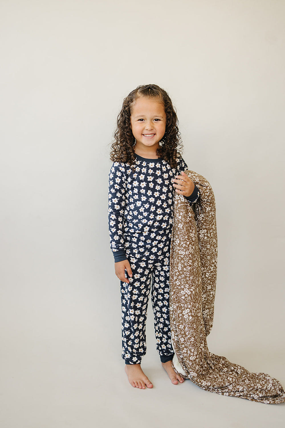 Brown floral bamboo fleece quilt for babies, perfect for cozy bedding and linens.