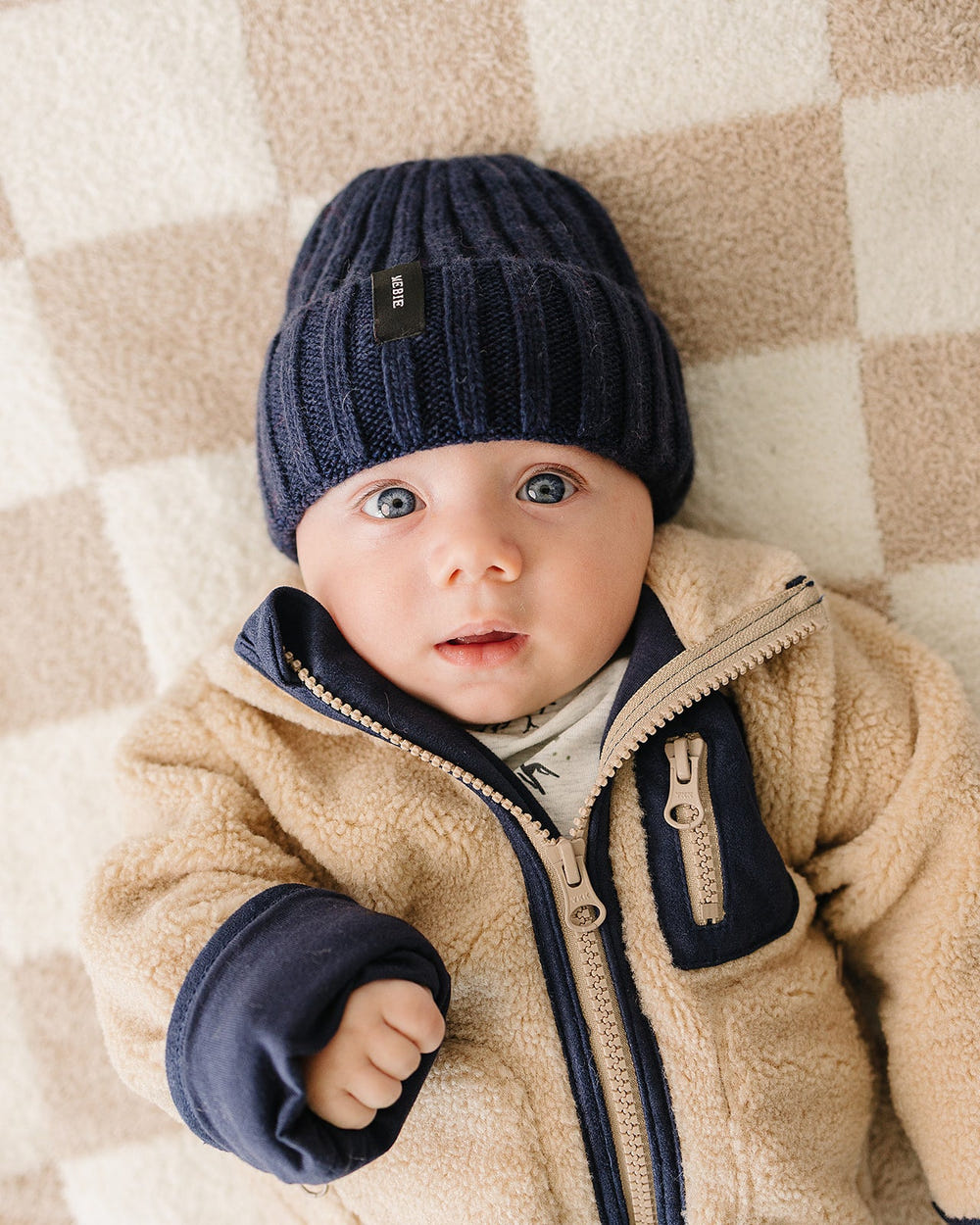 Navy chunky knit beanie for babies, stylish and warm winter accessory.