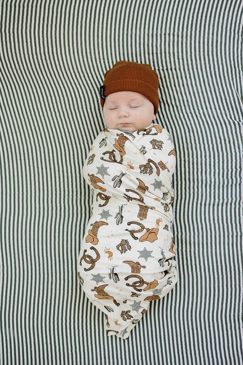 Outlaw Cowboy Ribbed Bamboo Stretch Swaddle for babies, soft and breathable bedding for comfortable sleep.