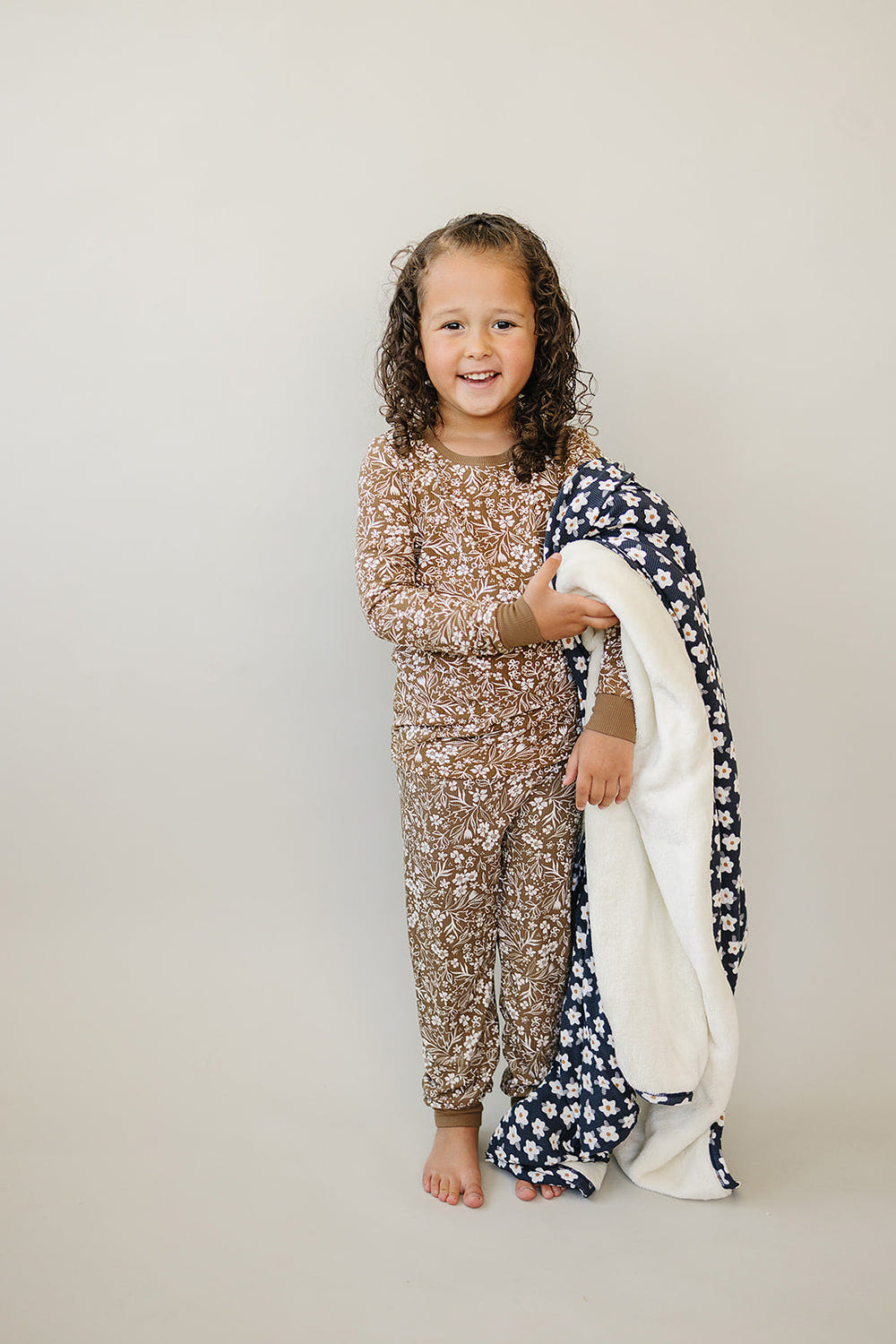 Brown floral ribbed bamboo cozy set for babies, featuring a soft two-piece design perfect for comfort and style.