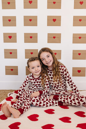 Soft Hearts Plush Blanket for babies, perfect for swaddling and cozy comfort. Angle view showcasing its adorable design.