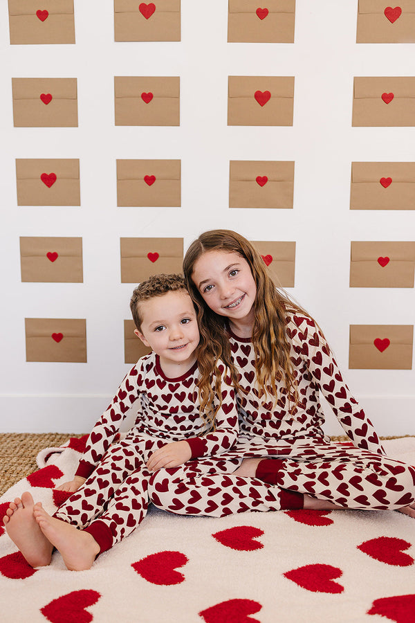 Soft Hearts Plush Blanket for babies, perfect for swaddling and cozy comfort. Angle view showcasing its adorable design.
