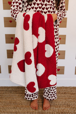 Soft Hearts Plush Blanket for babies, perfect for swaddling and cozy comfort. Angle view showcasing its adorable design.