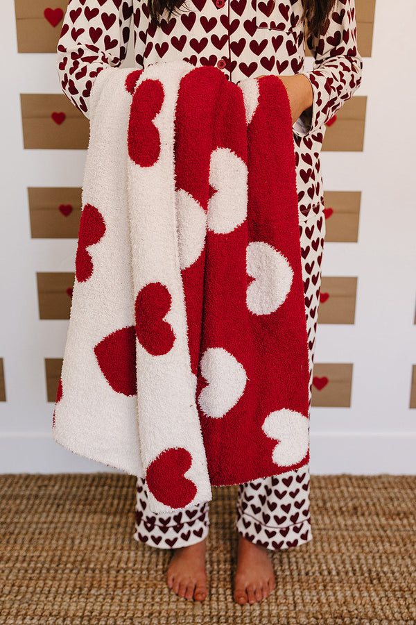 Soft Hearts Plush Blanket for babies, perfect for swaddling and cozy comfort. Angle view showcasing its adorable design.