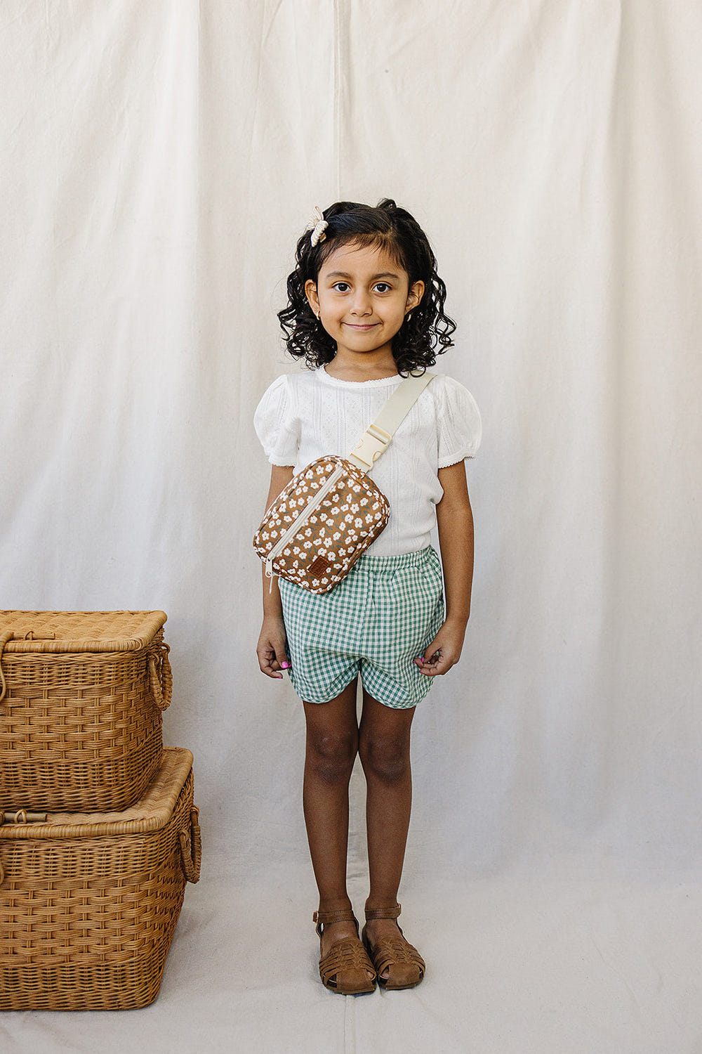 Mustard floral mini fanny pack for babies, perfect for toys and entertainment on-the-go.