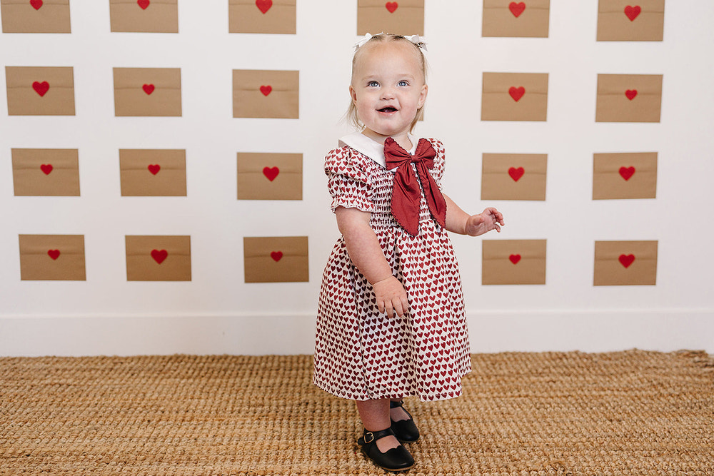 Heart Bow Dress for babies, featuring a cute design perfect for special occasions and everyday wear.