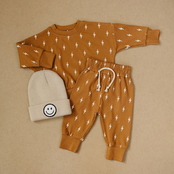 Baby jogger set in Fall Bolts design, featuring a cozy two-piece outfit for stylish comfort.