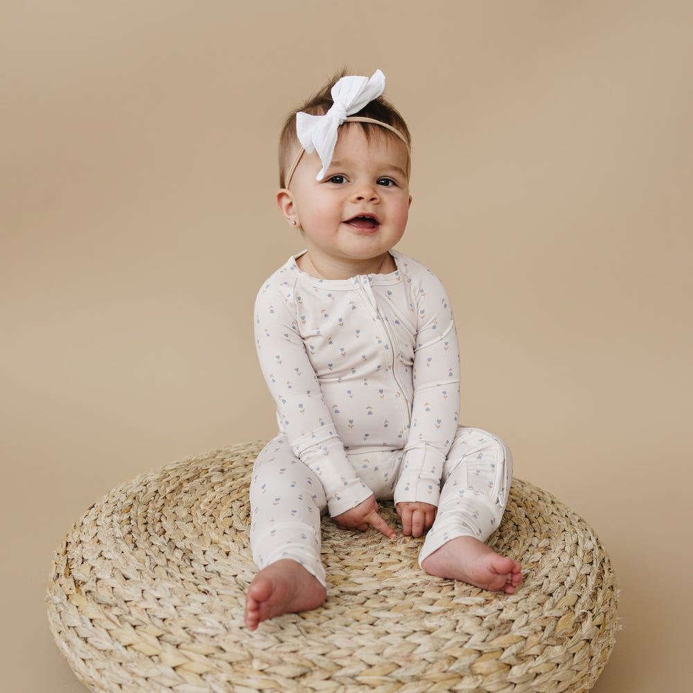 Tiny Tulips Bamboo Zippy Pajamas for babies in soft, breathable fabric, perfect for comfortable sleep and play.
