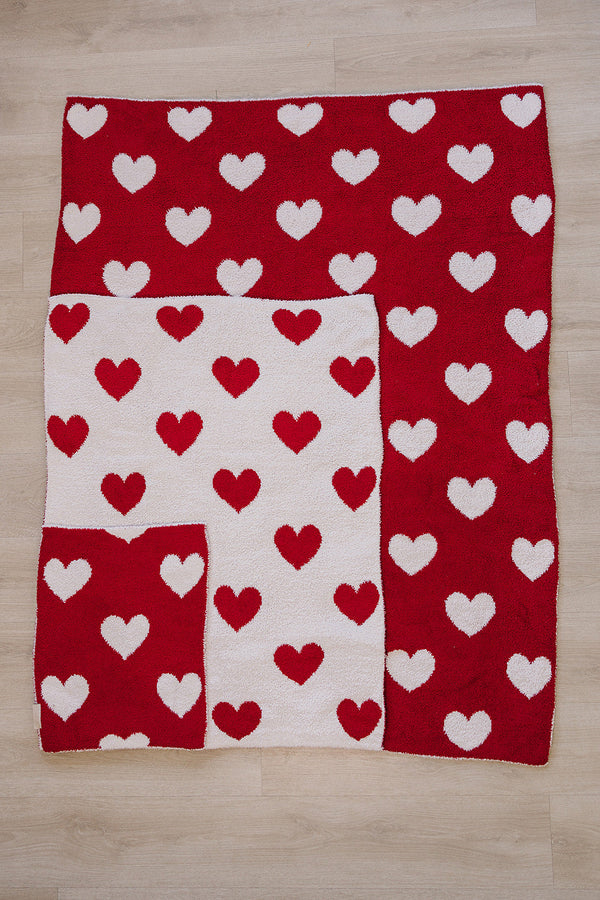 Soft Hearts Plush Blanket for babies, perfect for swaddling and cozy comfort. Angle view showcasing its adorable design.