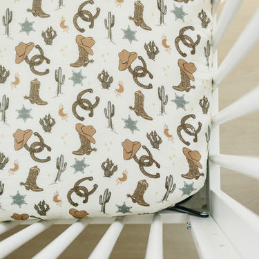 Outlaw Cowboy Muslin Crib Sheet for stylish and comfortable baby bedding and sleep.