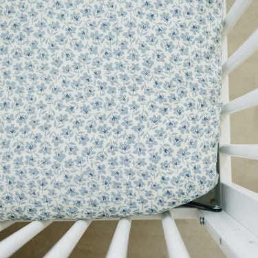 Blue Blossom Muslin Crib Sheet for stylish and comfortable baby bedding. Soft, breathable fabric for a cozy sleep environment.