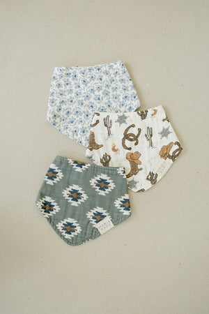 Outlaw Cowboy Classic Muslin Bib for babies, featuring a stylish cowboy design, angled view showcasing its softness and quality.