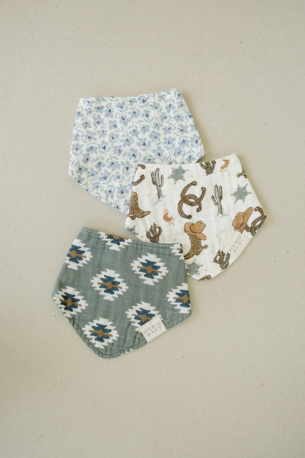 Outlaw Cowboy Classic Muslin Bib for babies, featuring a stylish cowboy design, angled view showcasing its softness and quality.