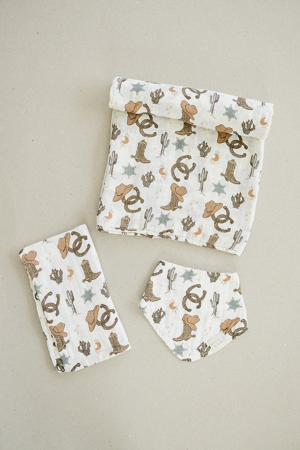 Outlaw Cowboy Classic Muslin Bib for babies, featuring a stylish cowboy design in angle 6 view.