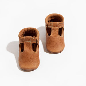 Zion T-Bar Baby Shoe in soft leather, perfect for stylish and comfortable little feet.