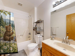 Meadow Picnic Camping shower curtain on a tub shower combo in an American family bathroom