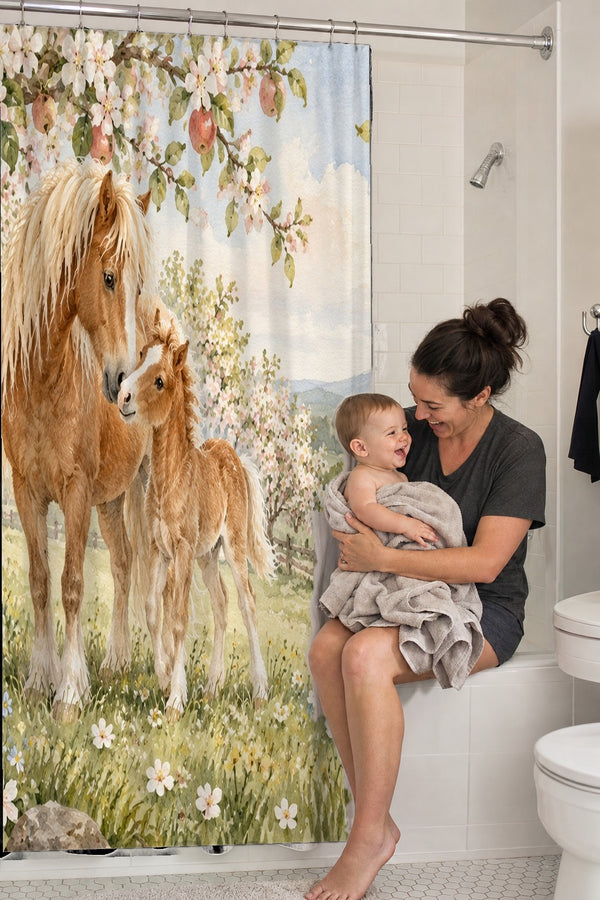 Mom holding her baby on the tub edge next to the Pony Orchard Farm shower curtain
