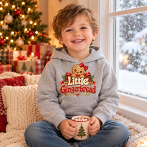 Child wearing the Little Gingerbread toddler hoodie at Christmas