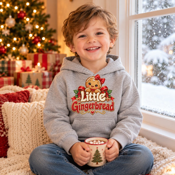 Child wearing the Little Gingerbread toddler hoodie at Christmas