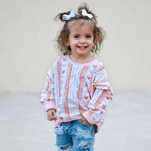Laced with Love Crewneck Sweatshirt for babies, stylish and cozy, shown from angle 4.