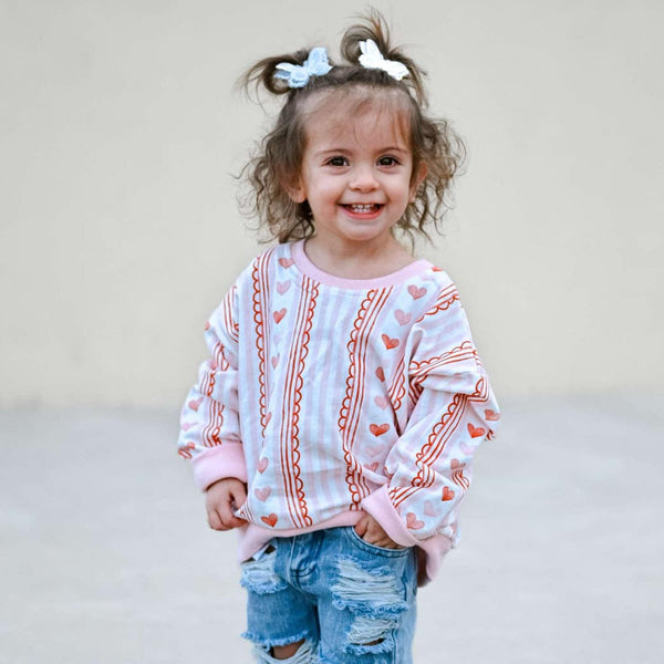 Laced with Love Crewneck Sweatshirt for babies, stylish and cozy, shown from angle 4.