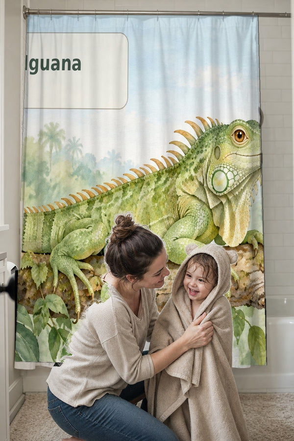 Mom drying her toddler in a hooded towel in front of the I is for Iguana Alphabet shower curtain