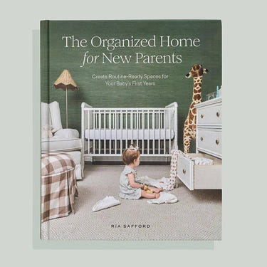 Hardcover book 'The Organized Home for New Parents' for baby care tips and organization.
