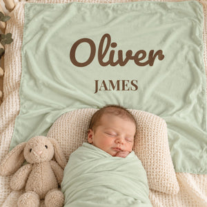 First and Middle Name swaddle blanket in sage, styled photo 2