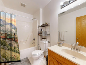 Sunrise Train shower curtain on a tub shower combo in an American family bathroom