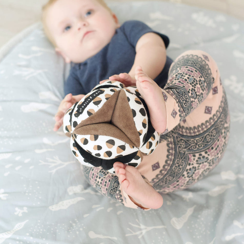 Colorful Clutch Ball - Acorn for babies, promoting sensory play and motor skills development.