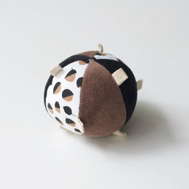 Taggy Ball with Rattle - Acorn, colorful baby toy for sensory play and development.