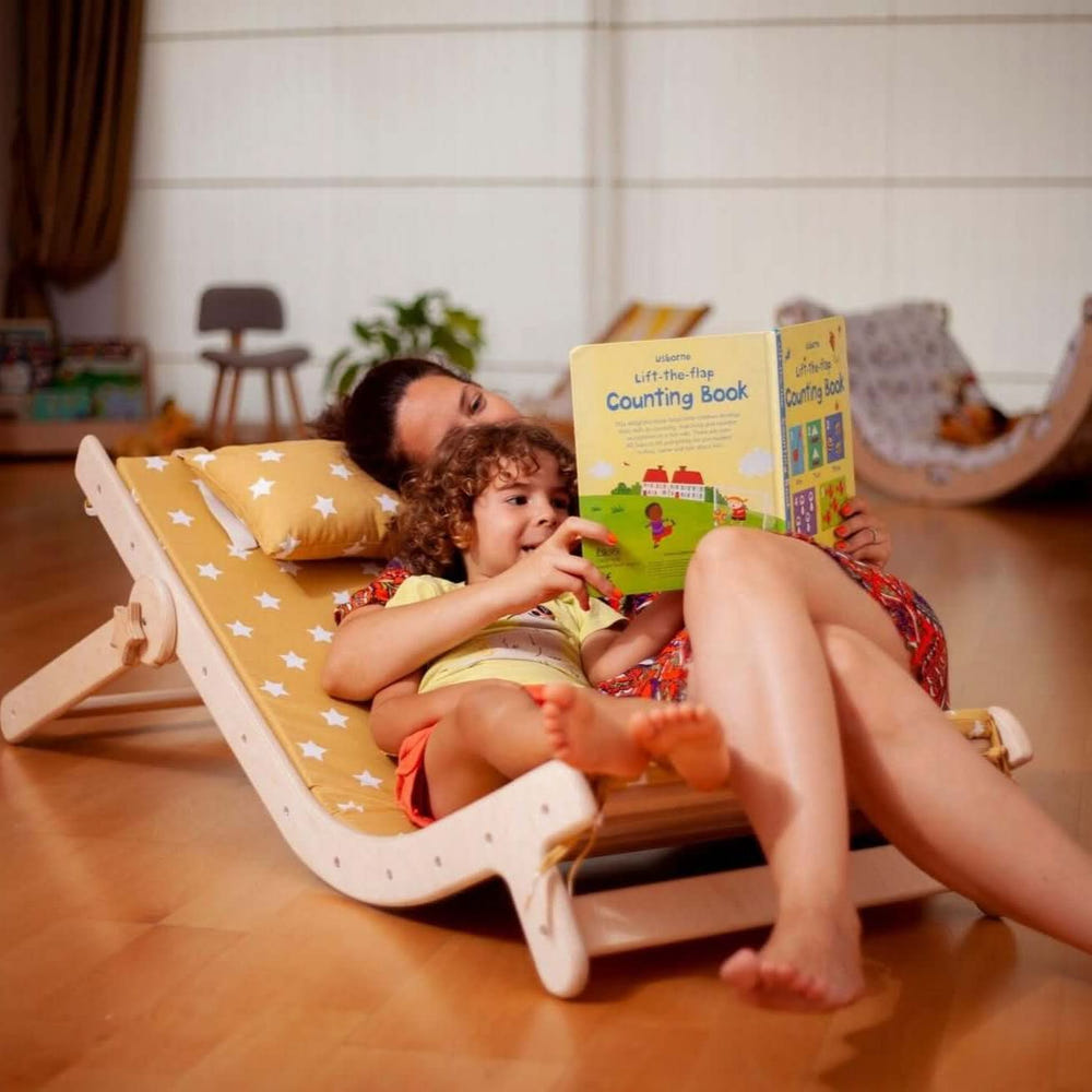 Adjustable lounge chair with comfy pad for kids, perfect for relaxation and playtime.