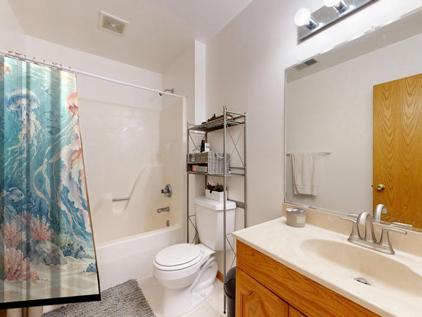 Jellyfish Garden Ocean shower curtain on a tub shower combo in an American family bathroom