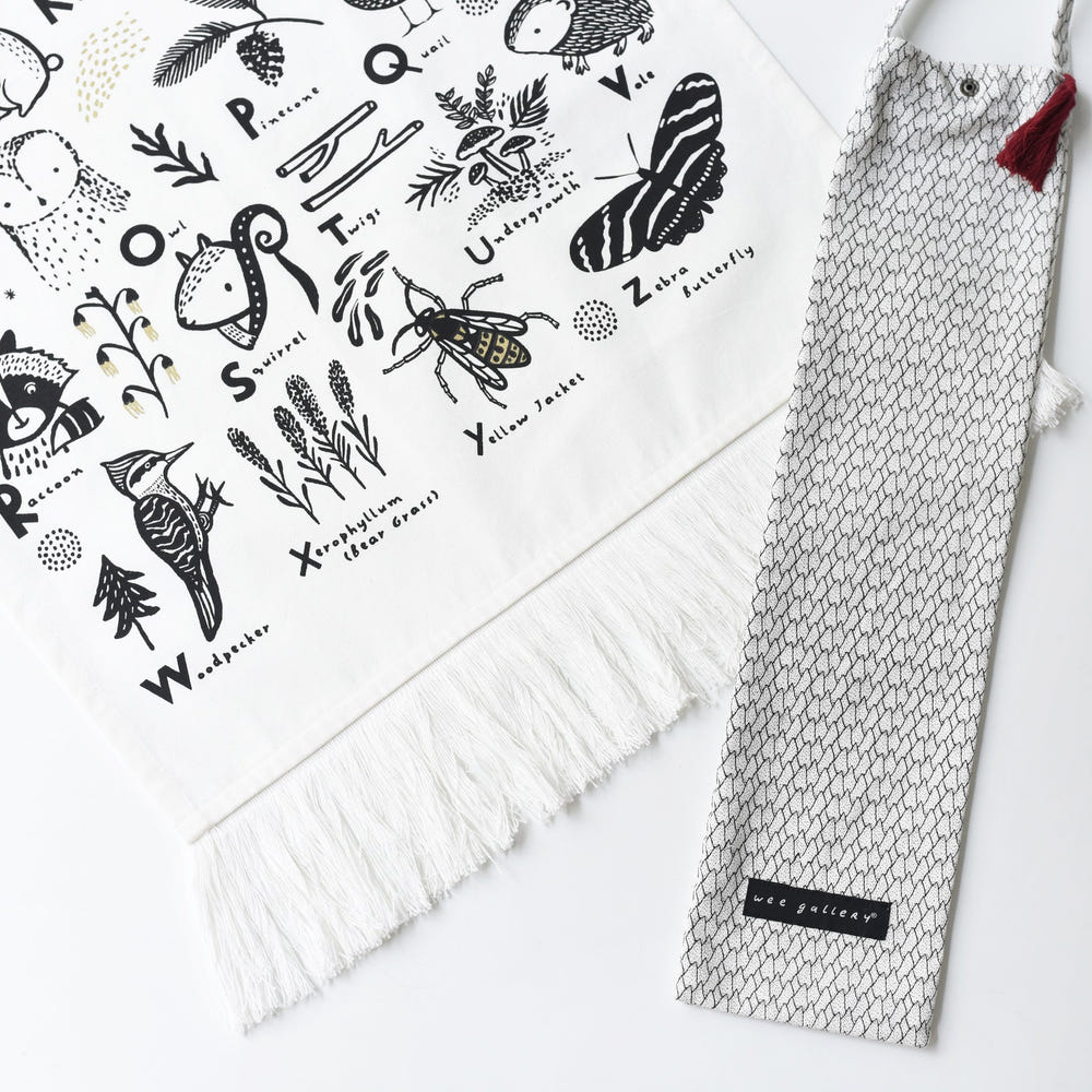 Woodland Alphabet Tapestry for nursery decor featuring playful animal designs and letters. Perfect for baby rooms.