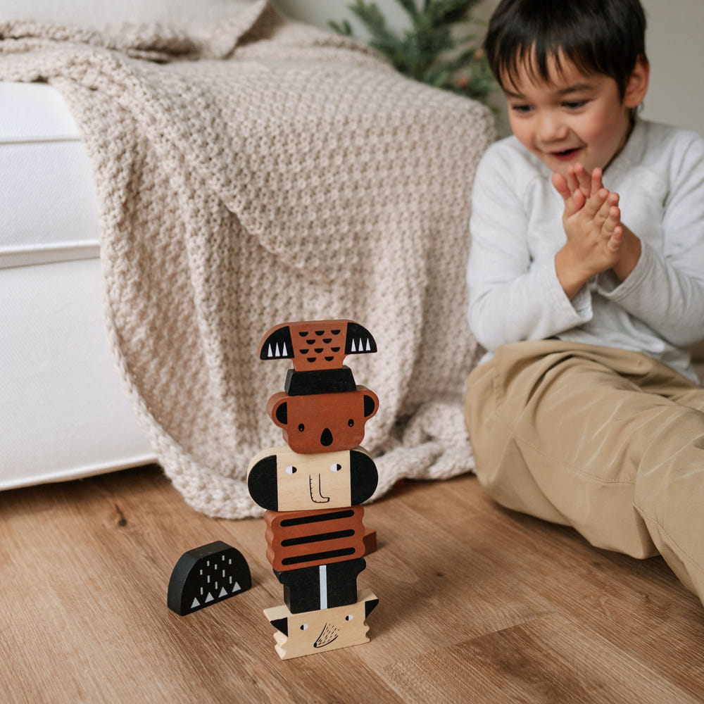 Colorful wooden animal building tower toy for babies, promoting creativity and motor skills development.